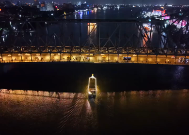 Aerial Night View of Howrah Bridge and Ferry River Kolkata, India