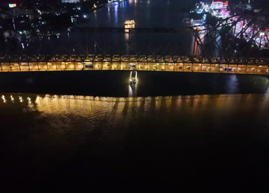 Aerial Night View of Howrah Bridge and Ferry River Kolkata, India