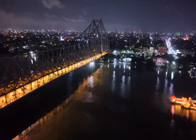 Aerial Night View of Howrah Bridge and Ferry River Kolkata, India