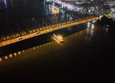 Aerial Night View of Howrah Bridge and Ferry River Kolkata, India