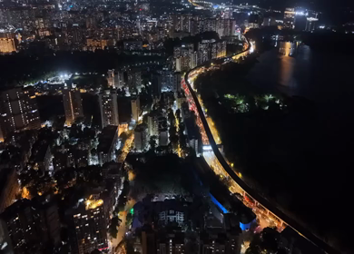 Aerial Night View of Powai Lake and Illuminated Mumbai Skyline India