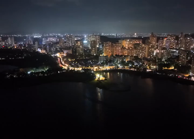 Aerial Night View of Powai Lake and Illuminated Mumbai Skyline India