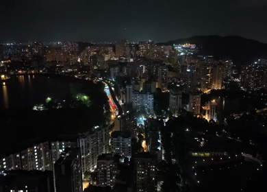 Aerial Night View of Powai Lake and Illuminated Mumbai Skyline India