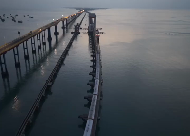 Aerial Night View of Train Crossing Pamban Bridge in Rameswaram Tamil Nadu India