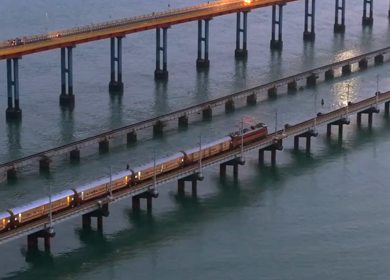 Aerial Night View of Train Crossing Pamban Bridge in Rameswaram Tamil Nadu India