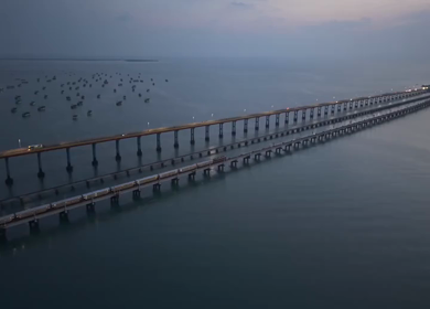 Aerial Night View of Train Crossing Pamban Bridge in Rameswaram Tamil Nadu India