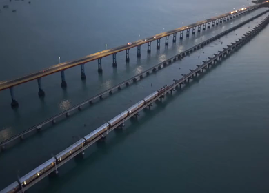 Aerial Night View of Train Crossing Pamban Bridge in Rameswaram Tamil Nadu India