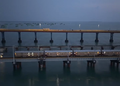 Aerial Night View of Train Crossing Pamban Bridge in Rameswaram Tamil Nadu India
