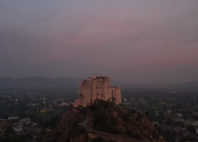 Aerial Night view of Alila Fort Bishangarh, a restored heritage palace hotel in Rajasthan, India
