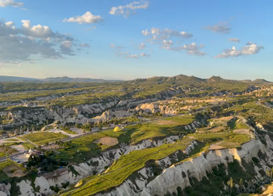 Aerial Panorama of Cappadocia Valleys and Rock Formations at Sunset in Turkey