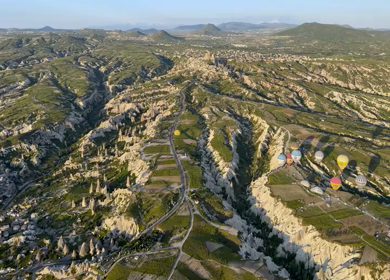 Aerial Panorama of Cappadocia Valleys and Rock Formations at Sunset in Turkey