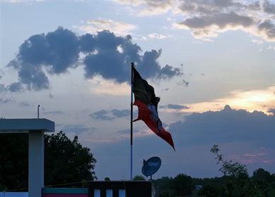 20th April 2026 : Aerial Shot of AIADMK Party Flag During Sunset in Rural Tamil Nadu India