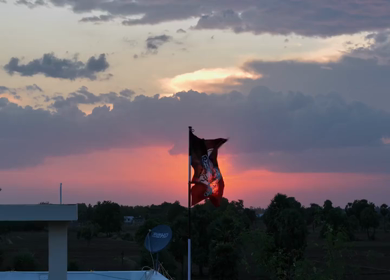 20th April 2026 : Aerial Shot of AIADMK Party Flag During Sunset in Rural Tamil Nadu India