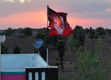 20th April 2026 : Aerial Shot of AIADMK Party Flag During Sunset in Rural Tamil Nadu India