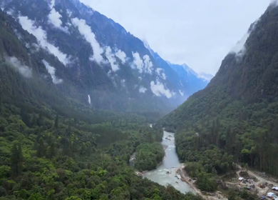 Aerial Shot of Anini Valley with River and Misty Mountains Arunachal Pradesh India