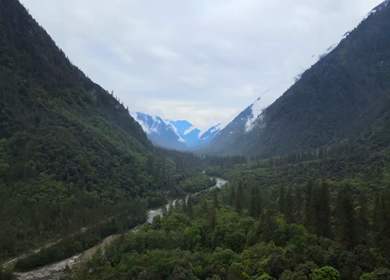 Aerial Shot of Anini Valley with River and Misty Mountains Arunachal Pradesh India