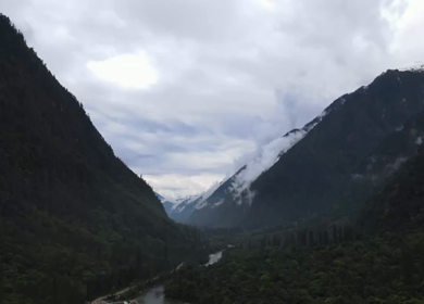 Aerial Shot of Anini Valley with River and Misty Mountains Arunachal Pradesh India