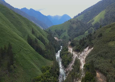 Aerial Shot of Anini Valley with River and Misty Mountains Arunachal Pradesh India