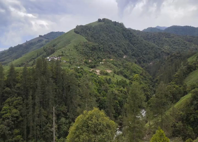 Aerial Shot of Anini Valley with River and Misty Mountains Arunachal Pradesh India