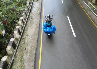 Aerial Shot of Tourist Biker Riding on Mountain Road in Arunachal Pradesh India