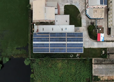 An aerial shot of solar panels installed on roof 