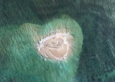 Aerial Slow motion View of Sandbar Island and Turquoise Sea at Erwadi Tamil Nadu India