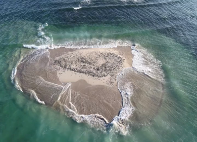 Aerial Slow motion View of Sandbar Island and Turquoise Sea at Erwadi Tamil Nadu India