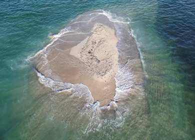 Aerial Slow motion View of Sandbar Island and Turquoise Sea at Erwadi Tamil Nadu India