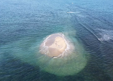 Aerial Slow motion View of Sandbar Island and Turquoise Sea at Erwadi Tamil Nadu India