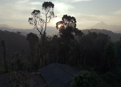 Aerial Sunrise Over Misty Forest and Mountains Sri Lanka