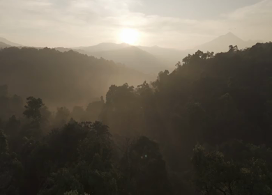 Aerial Sunrise Over Misty Forest and Mountains Sri Lanka