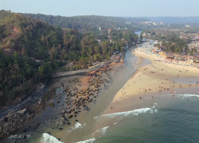 Aerial View of Baga Beach with Tourists and Shoreline Goa India