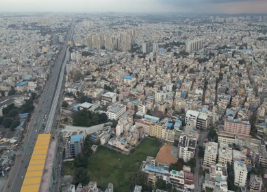 Aerial View of Bangalore City with Metro Line and Highway Bengaluru India