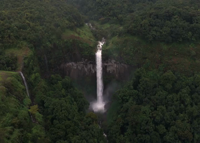 Aerial View of Barki Waterfall Amid Lush Green Forest Kolhapur Maharashtra