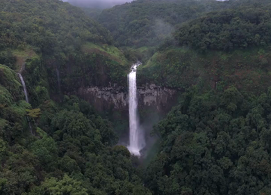 Aerial View of Barki Waterfall Amid Lush Green Forest Kolhapur Maharashtra