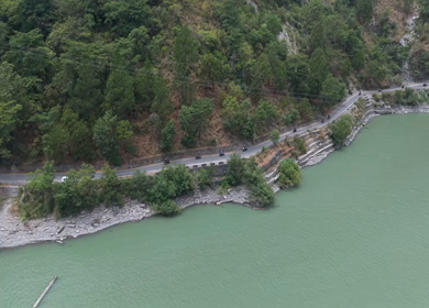 Aerial View of Bikers Riding Along Chamera Lake Road, Himachal Pradesh, India