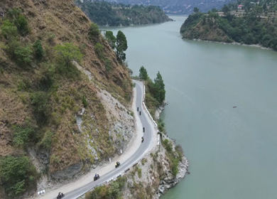 Aerial View of Bikers Riding Along Chamera Lake Road, Himachal Pradesh, India