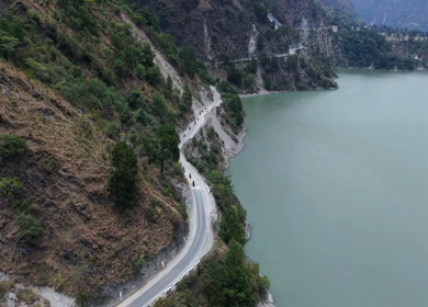 Aerial View of Bikers Riding Along Chamera Lake Road, Himachal Pradesh, India