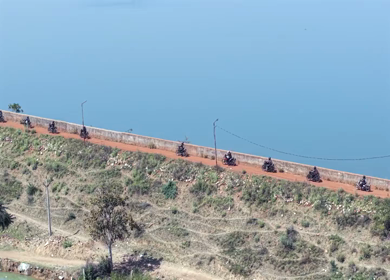 Aerial View of Bikers Riding Along Kolar Dam Reservoir Madhya Pradesh