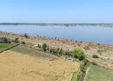 Aerial View of Bikers Riding Along Kolar Dam Reservoir Madhya Pradesh