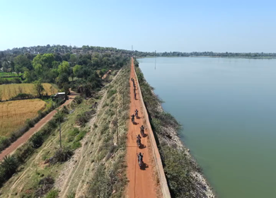 Aerial View of Bikers Riding Along Kolar Dam Reservoir Madhya Pradesh