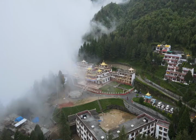 Aerial View of Bomdila Monastery in Misty Himalayan Landscape Arunachal Pradesh India