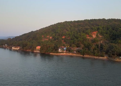 Aerial View of Calm Sea and Forested Coastline Goa India