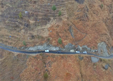 Aerial View of Mountain Village and Car Convoy in Kinnaur Himachal Pradesh