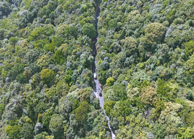 Aerial View of Cars Driving Through Mountain Road in Meghalaya India