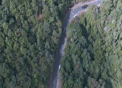 Aerial View of Cars Driving Through Mountain Road in Meghalaya India