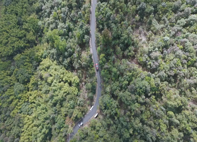 Aerial View of Cars Driving Through Mountain Road in Meghalaya India