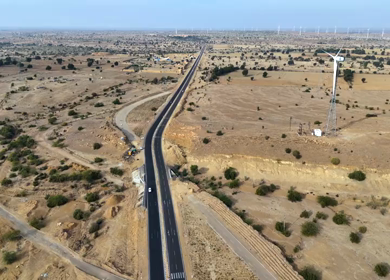 Aerial View of Desert Highway with Wind Turbines in Jaisalmer Rajasthan India