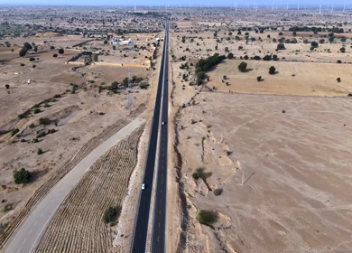 Aerial View of Desert Highway with Wind Turbines in Jaisalmer Rajasthan India