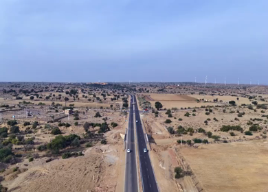 Aerial View of Desert Highway with Wind Turbines in Jaisalmer Rajasthan India